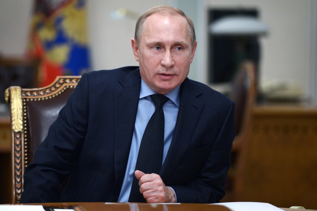 Russian President Vladimir Putin speaks at a cabinet meeting outside Moscow as ratings agency S&P downgraded the country's economy to junk. Photo: AP