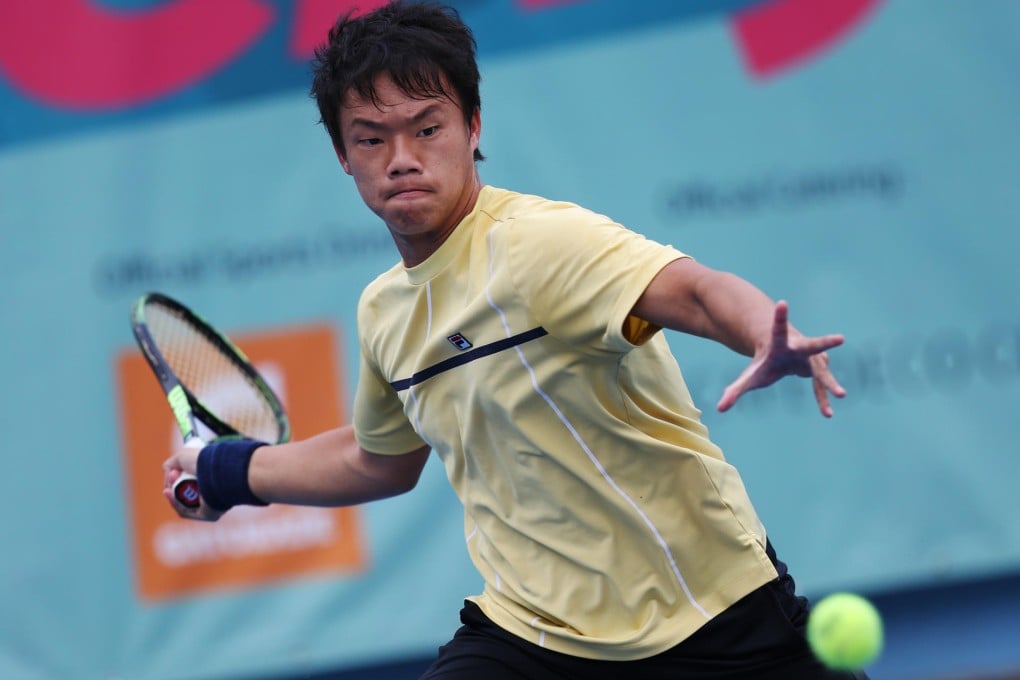 Hong Kong's Andrew Li returns against Japan's Tasuma Ito during his first-round defeat at Victoria Park on Wednesday. Photo: Nora Tam