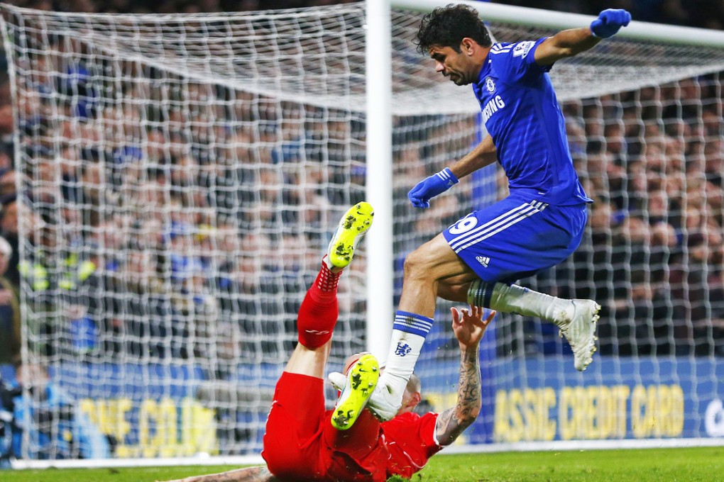 An accident? Diego Costa lands on Martin Skrtel, one of two stamping incidents for which he might be retrospectively punished. Photo: Reuters