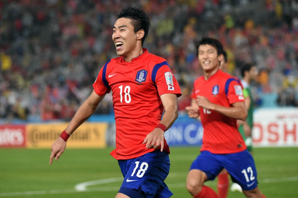 South Korea's Lee Jeong-hyeop celebrates scoring the first goal against Iraq during the semi-final against Iraq. Photo: AFP