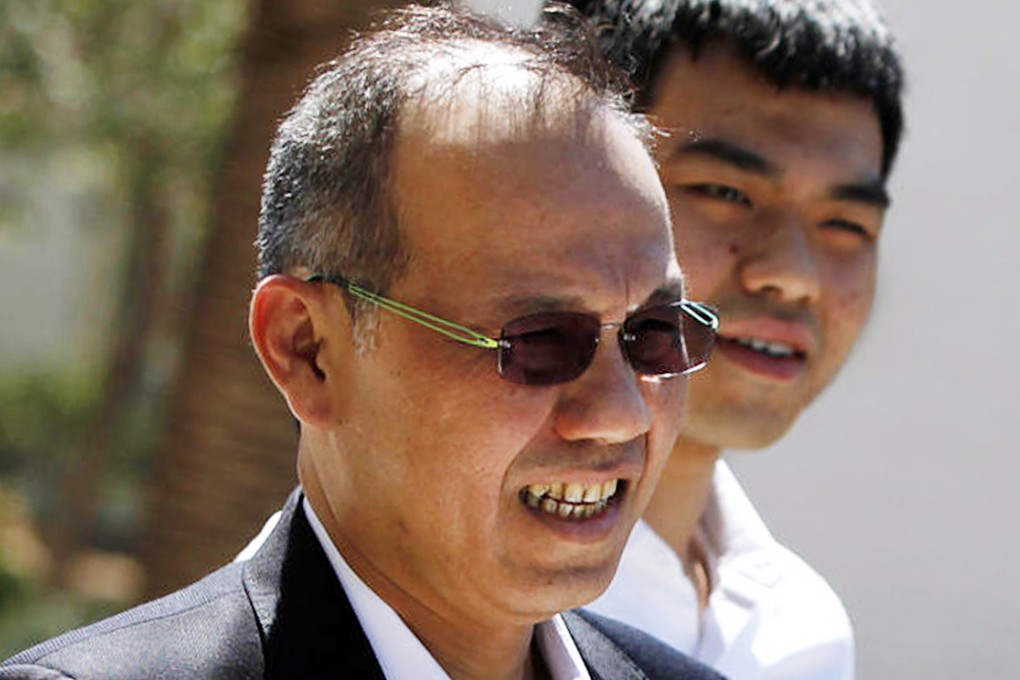 Paul Phua and his son Darren in an August 5 photograph. Photo: AP