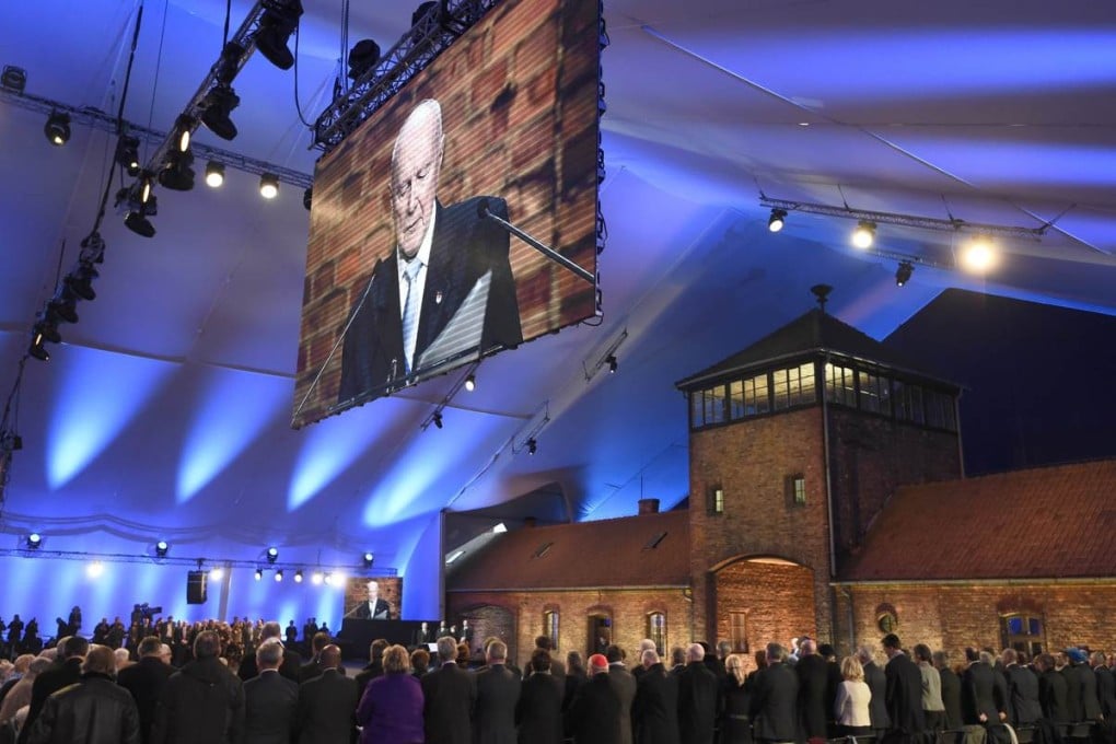 Holocaust survivor Kazimierz Albin receives a standing ovation after delivering a speech in front of the entrance to the former Nazi concentration camp Auschwitz. Photo: AFP
