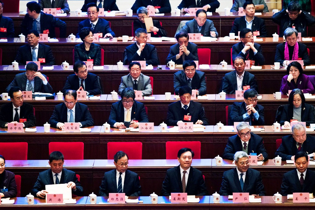 Chinese delegates attend a party plenum last year. Photo: AFP