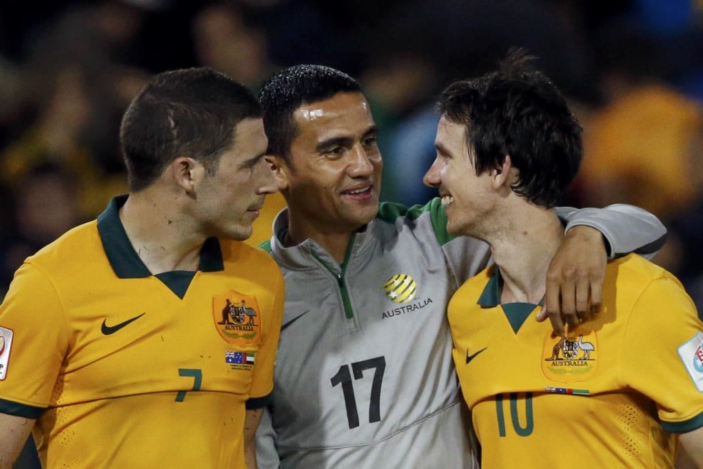 Australia captain Tim Cahill (centre) celebrates with teammates Mathew Leckie (left) and Robbie Kruse after their semi-final win against UAE. Photo: Reuters