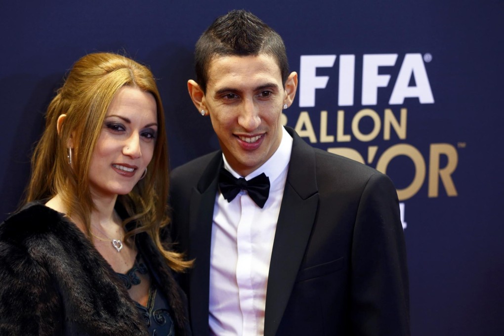 The transfer fee for Angel di Maria (pictured with his wife Jorgelina Cardoso) to move from Real Madrid to Manchester United was 59.7 million pounds - a record in the British market. Photo: Reuters