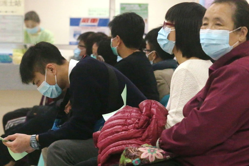 Patients reporting fevers wait to be seen at a Hong Kong hospital.