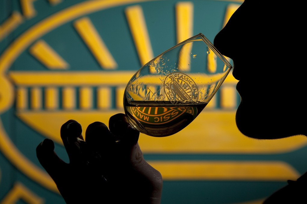 A man in Yiwu who drank two litres of liquor at a business dinner suffered a gastric perforation and lapsed into a coma. Photo: Bloomberg