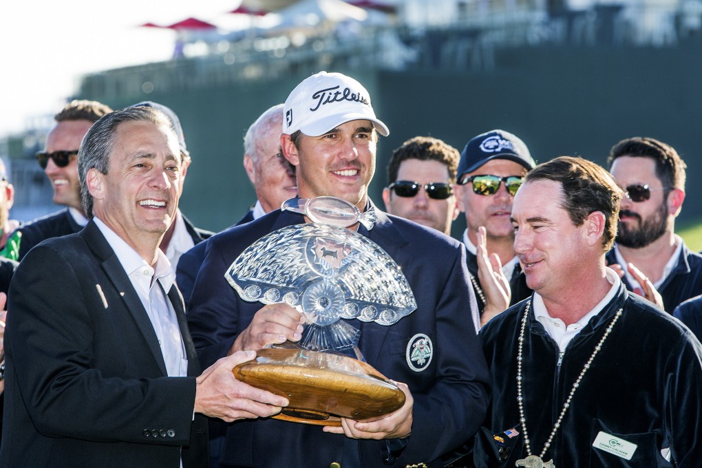 Brooks Koepka holds the trophy after winning the 2015 Waste Management Phoenix Open at TPC Scottsdale. Photo: USA Today Sports