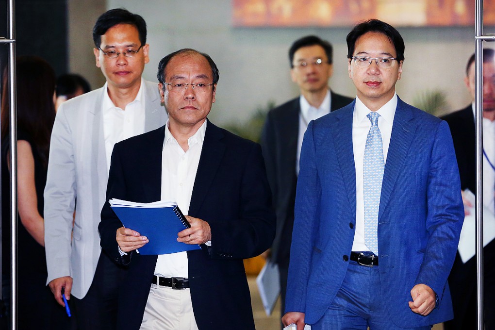 Lawmakers Ip Kin-yuen, Frederick Fung Kin-kee, and Charles Mok, leave Central Government Offices (CGO), after a meeting in August 2014 with Liaison Office Director Zhang Xiaoming and Chief Secretary Lam Cheng Yuet-ngor, Tamar. Photo: Nora Tam
