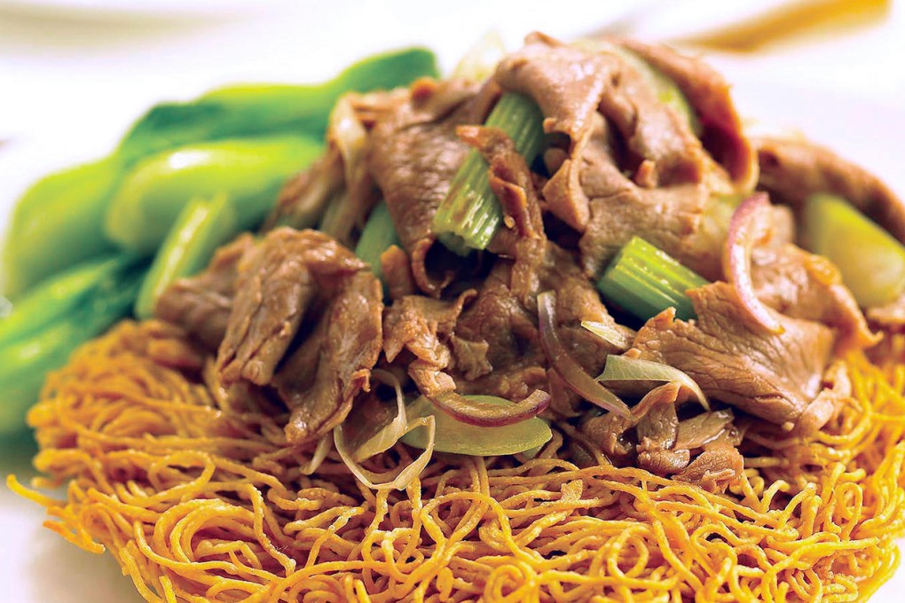 Pan-fried crispy noodles topped with mutton and vegetables at Dong Lai Shun.