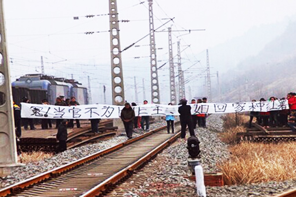 Protesters on the track in Henan province. Photo: SCMP Pictures