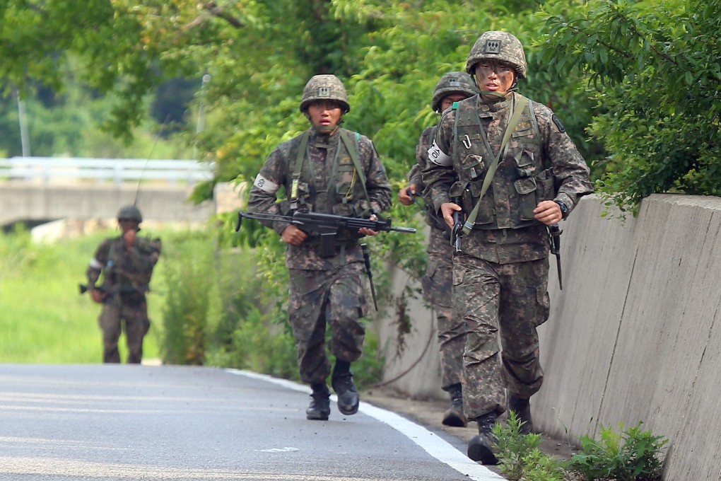 South Korean soldiers patrol along a roadside near the Demilitarized Zone (DMZ) between the two Koreas. Photo: AFP