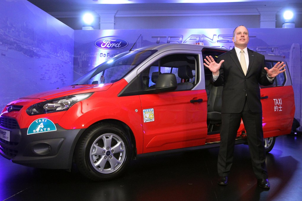 Ford executive David Westerman shows off his company's new taxi model, which he hopes can be used to target tourists. Photo: Edward Wong