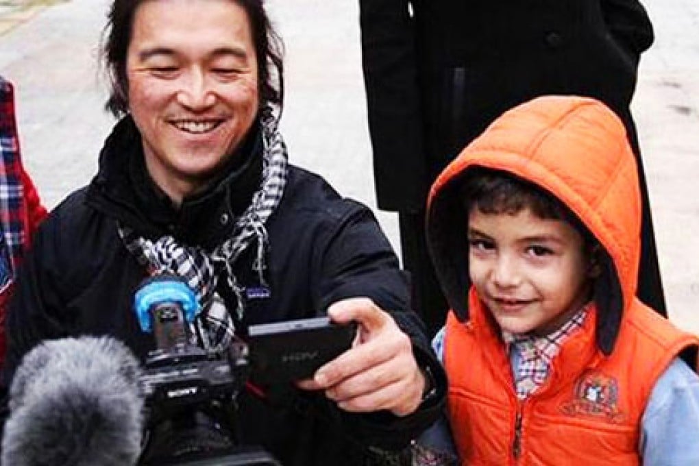 Kenji Goto at work. He devoted his career to telling the stories of the victims of war. Photo: Facebook