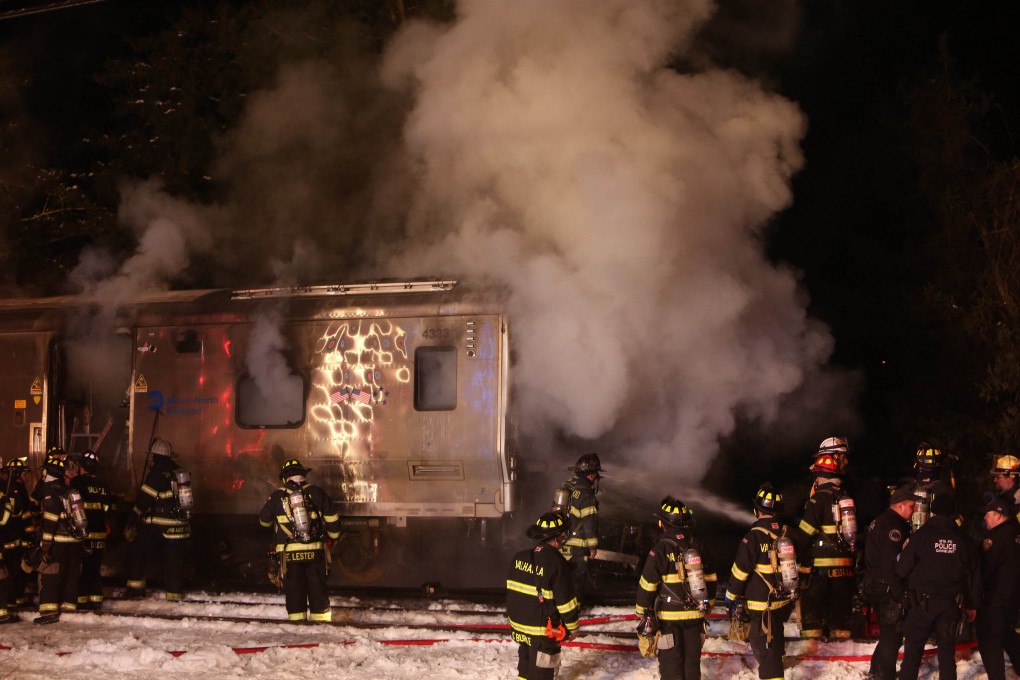 Firefighters work the scene of a collision between a Metro-North Railroad passenger train and a vehicle in Valhalla, New York. Photo: AP
