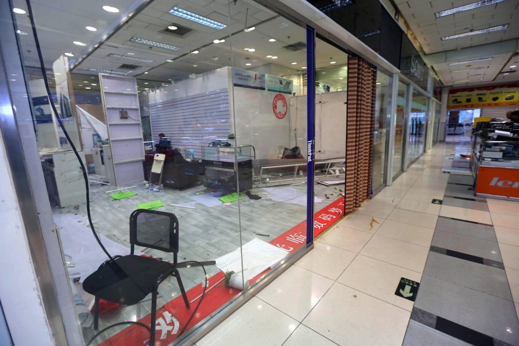Empty stalls and deserted halls at a mall in Zhongguancun, Beijing, victims of the rise of internet shopping. Photo: Imaginechina