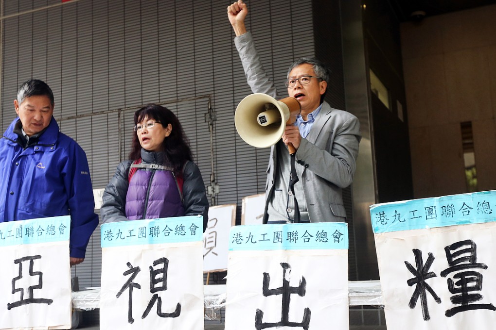 Members of Hong Kong and Kowloon Trades Union Council protest outside Labour Tribunal to support ATV staff in Jordan on February 2, 2015. Photo: David Wong