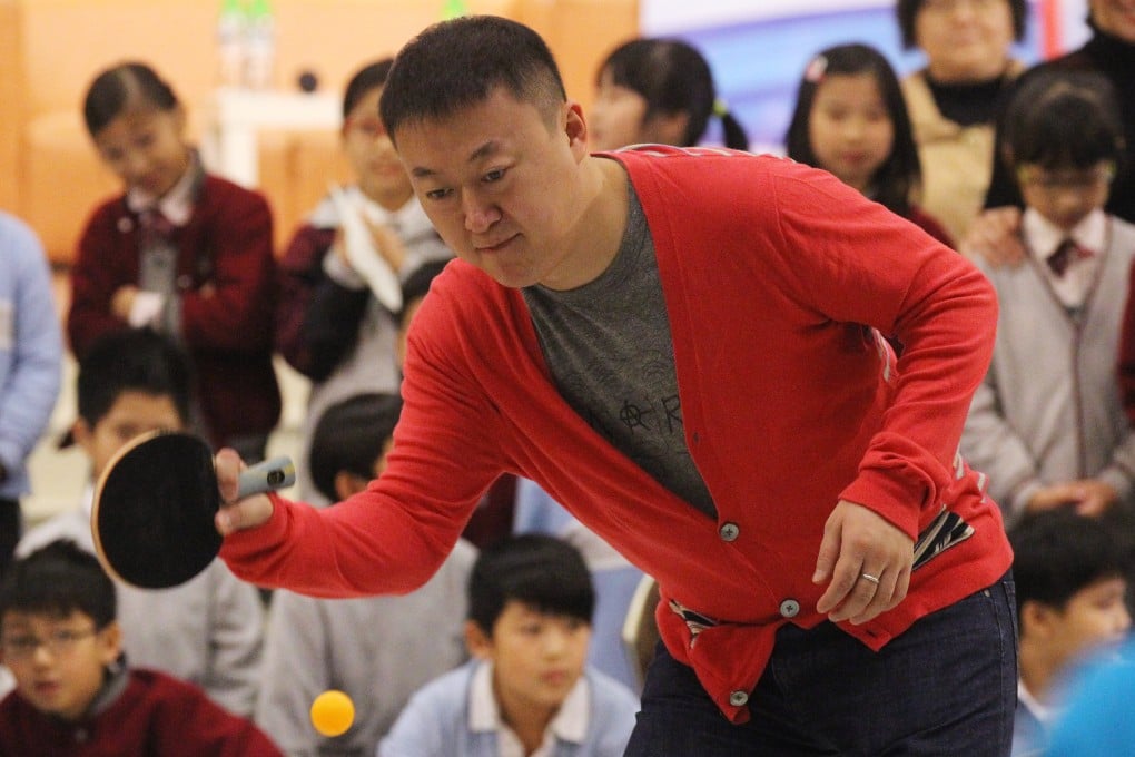 Ma Lin, the 2008 Beijing Games table tennis champion, training with students at Creative Primary School in Kowloon Tong. Photo: Edward Wong