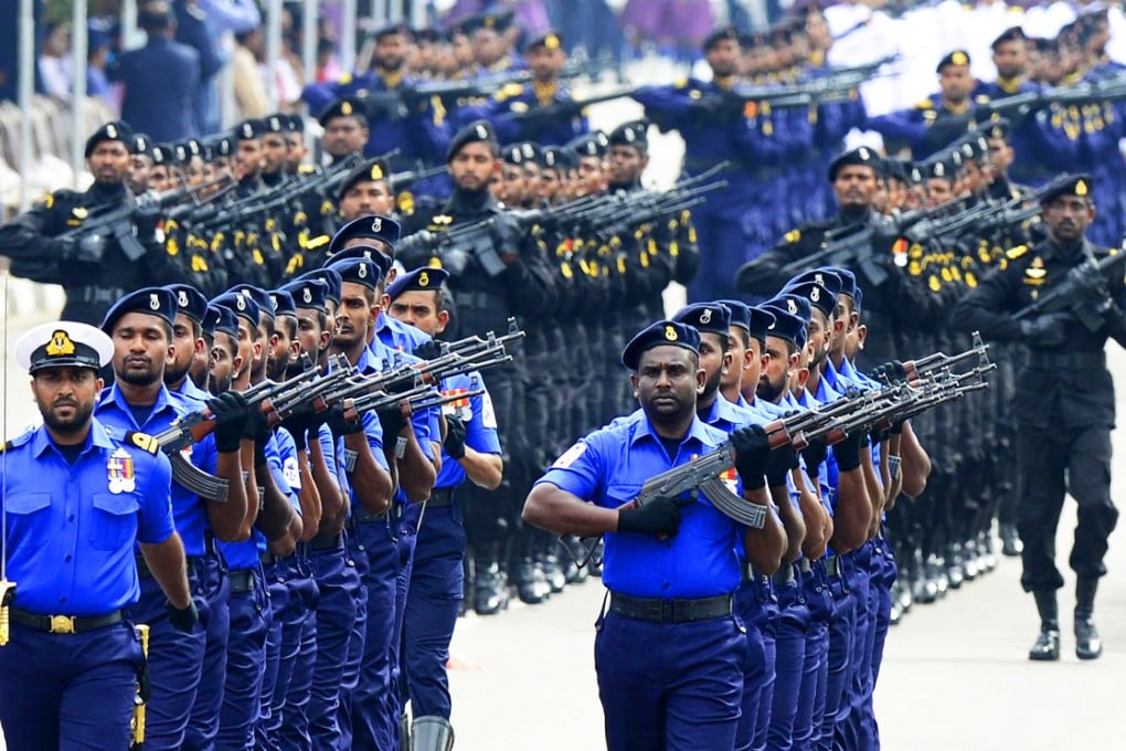 Sri Lankan military personnel march past during the country's 67th Independence Day celebrations in Colombo. Photo: AFP