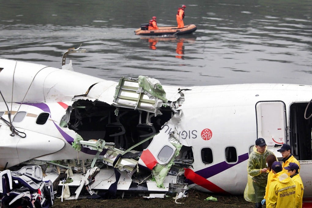 Members of a search-and-rescue team near the wreckage of the aircraft. Photo: AFP