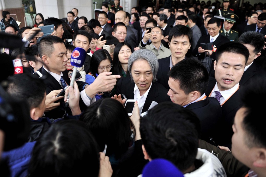 Comedian Stephen Chow is surrounded by reporters. His appearance at the meeting provided some light relief in proceedings otherwise overshadowed by graft. Photo: CFP