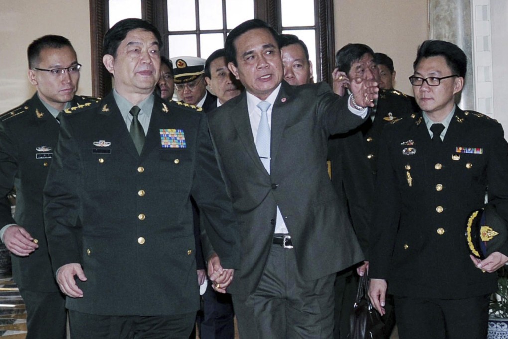 Defence Minister Chang Wanquan (left) speaks with Thai Prime Minister Prayuth Chan-ocha in Bangkok yesterday. China and Thailand yesterday agreed to increase military links from increasing intelligence sharing to fighting transnational crime. Photo: Reuters