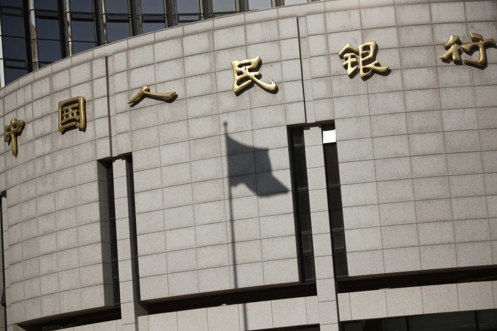 China's central bank cut the amount of cash that banks must hold as reserves on Wednesday. Photo: Reuters