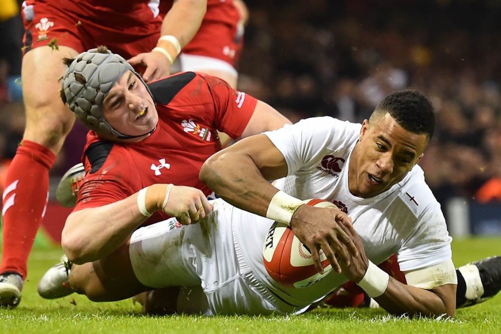 Winger Anthony Watson scores a try for England during their opening Six Nations Championship clash with Wales on Friday at the Millennium Stadium in Cardiff. England won the match 21-16. Photos: AFP
