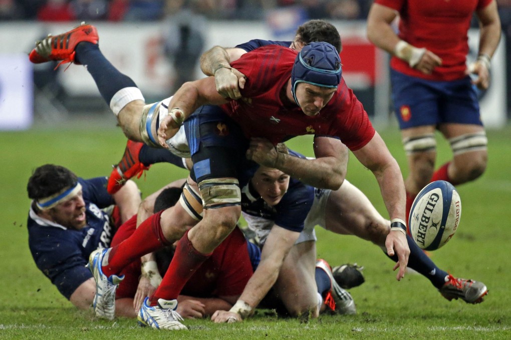 France's Bernard le Roux  tries to catch the ball against Scotland. Photos: Reuters