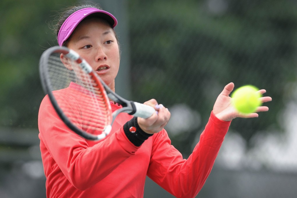 Hong Kong's Tiffany Wu Ho-ching hits a return against Eri Hozumi of Japan at the Guangdong Olympic Tennis Centre in Guangzhou. Photo: AFP