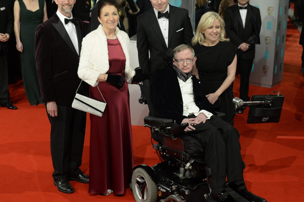 Physicist Stephen Hawking on the BAFTA awards red carpet, with wife Jane (left) and daughter Lucy (right). Photo: EPA
