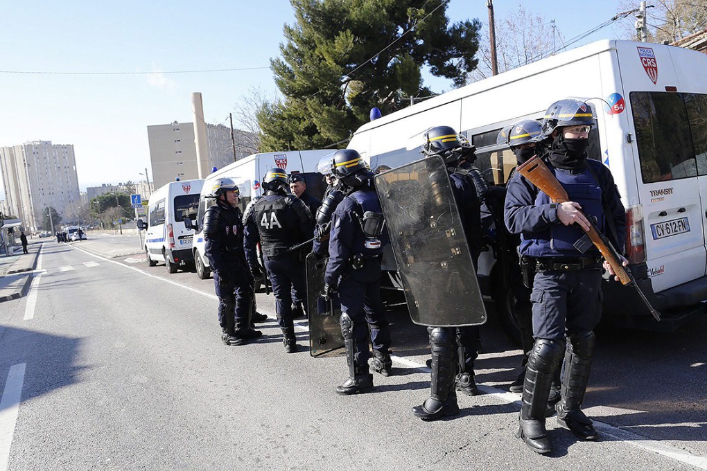 Members of the National Security forces stand guard near La Castellane area of northern Marseilles. Photo: EPA
