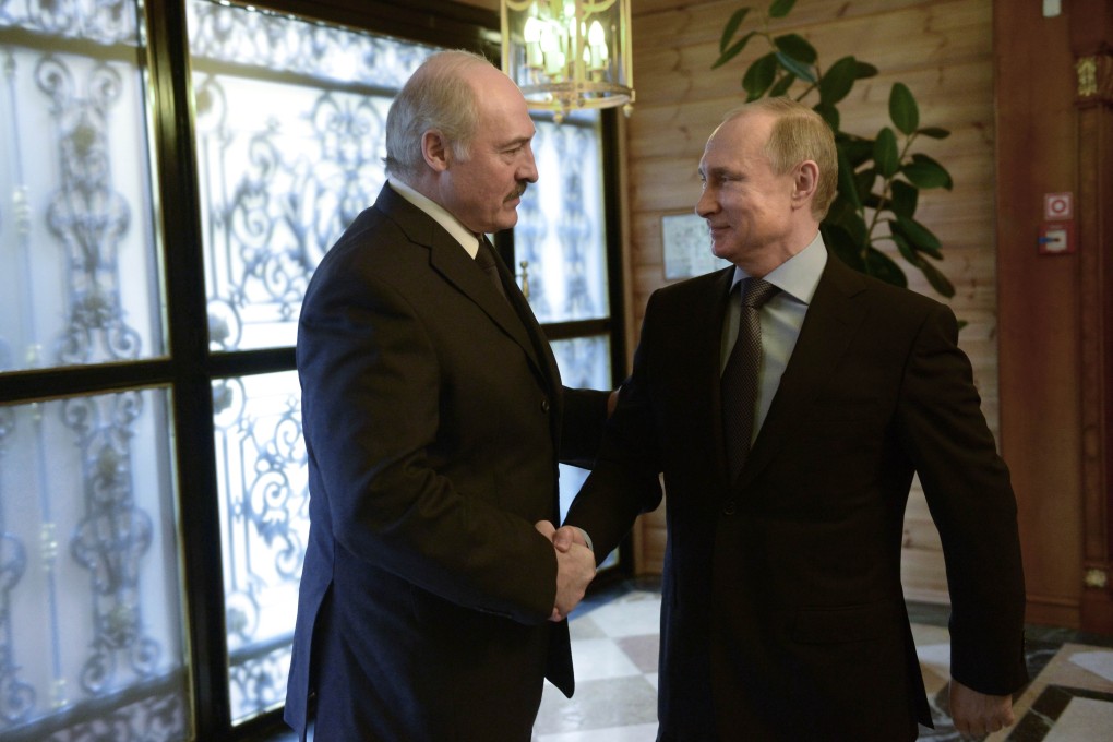 Russian President Vladimir Putin (right) shakes hands with his Belarussian counterpart Alexander Lukashenko during their meeting in Sochi on Sunday. Photo: AFP