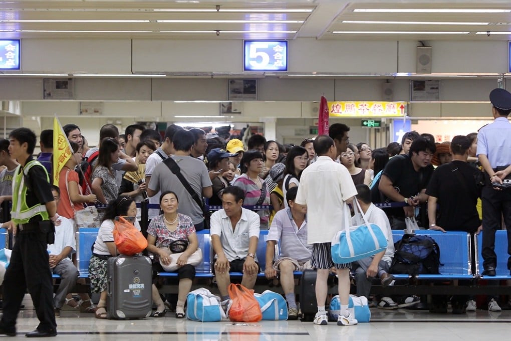 Tourists at the Huanggang Port. Eight customs officers are standing trial for taking hundreds of thousands of yuan in bribes. Photo: May Tse