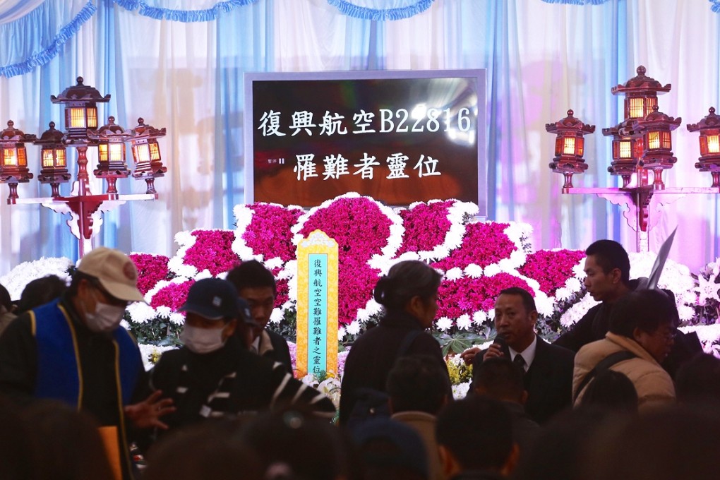 Relatives of victims of last week's TransAsia air crash attend today's memorial service in Taipei's Second Funeral Parlour. Photo: CNA