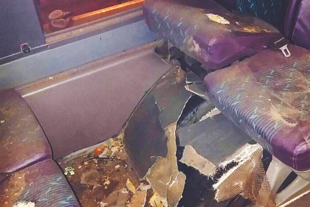 A rear left tyre exploded causing damage to the inside of the bus. Photo: SCMP Pictures