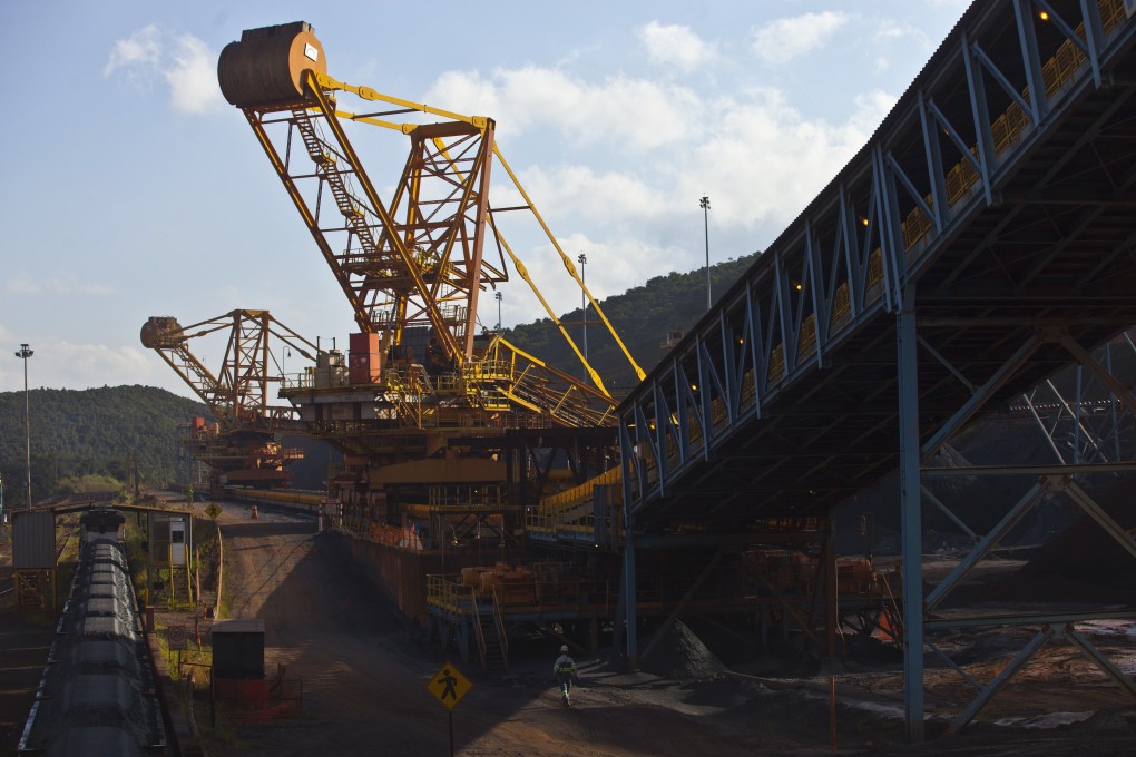 Crushed iron ore is loaded into railroad cars in Brazil. China has lifted its ban on Valemax ships transporting the ore to the country. Photo: Bloomberg