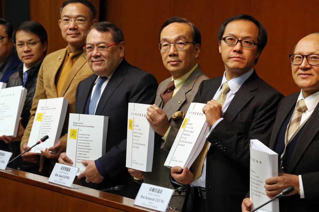 Members of the Public Accounts Committee present their report, which slams Norman Lo, director general of civil aviation. Members include chairman Abraham Razack (fourth from left). Photo: K. Y. Cheng