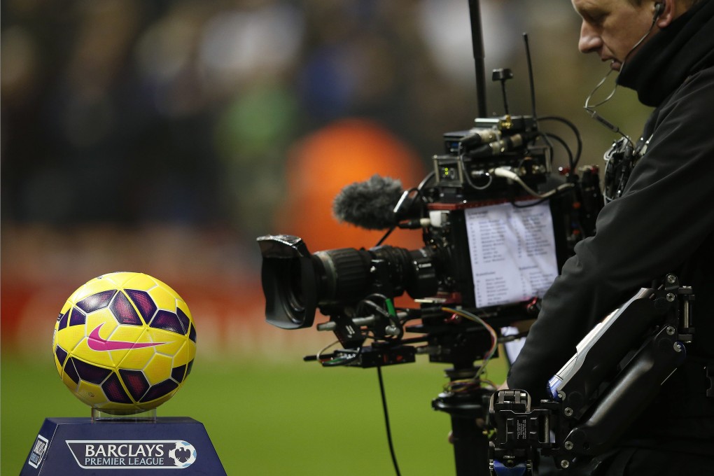 A cameraman takes a shot during the Liverpool-Tottenham game on Tuesday night. Photo: Reuters