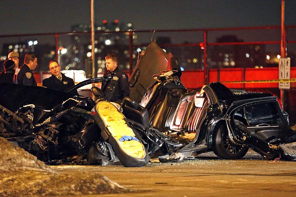 Officials at the scene of a fatal collision in Manhattan. Photo: AP