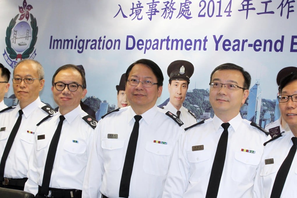 Director of Immigration Eric Chan Kwok-ki (centre) told the media that the Immigration Department aims to recruit 60 assistants this year. Photo: Edward Wong.