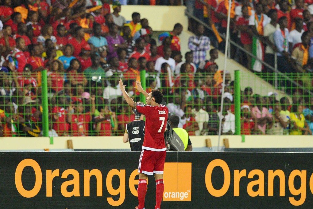 Reuban Belima of Equatorial Guinea pleads for calm from the crowd during a stormy semi-final encounter between Ghana and Equatorial Guinea during a sporadically violent Africa Cup of Nations. Photo: EPA