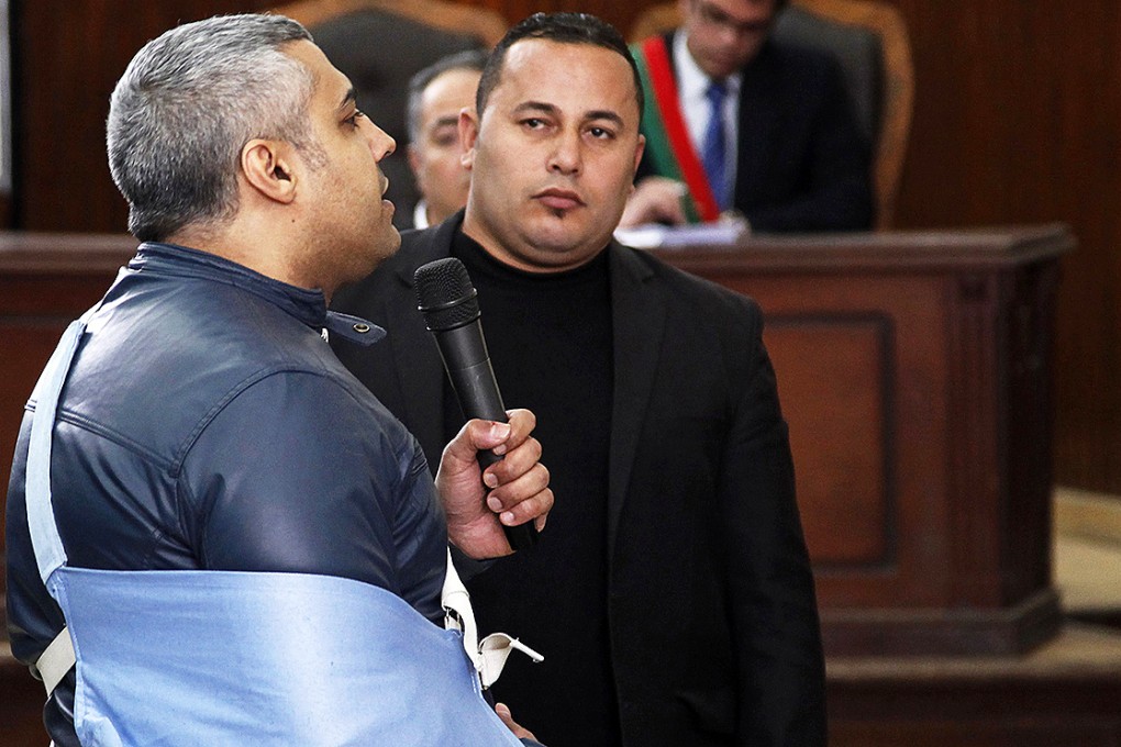 Al Jazeera journalist Mohamed Fahmy speaks before the judge at a court in Cairo. Photo: Reuters