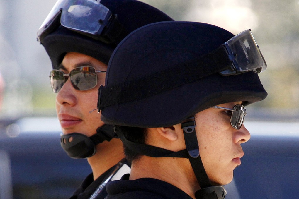 Guards at a Chinese garrison have been commended after tackling a knife-wielding drug addict, who tried to break in to steal weapons. File photo: Reuters