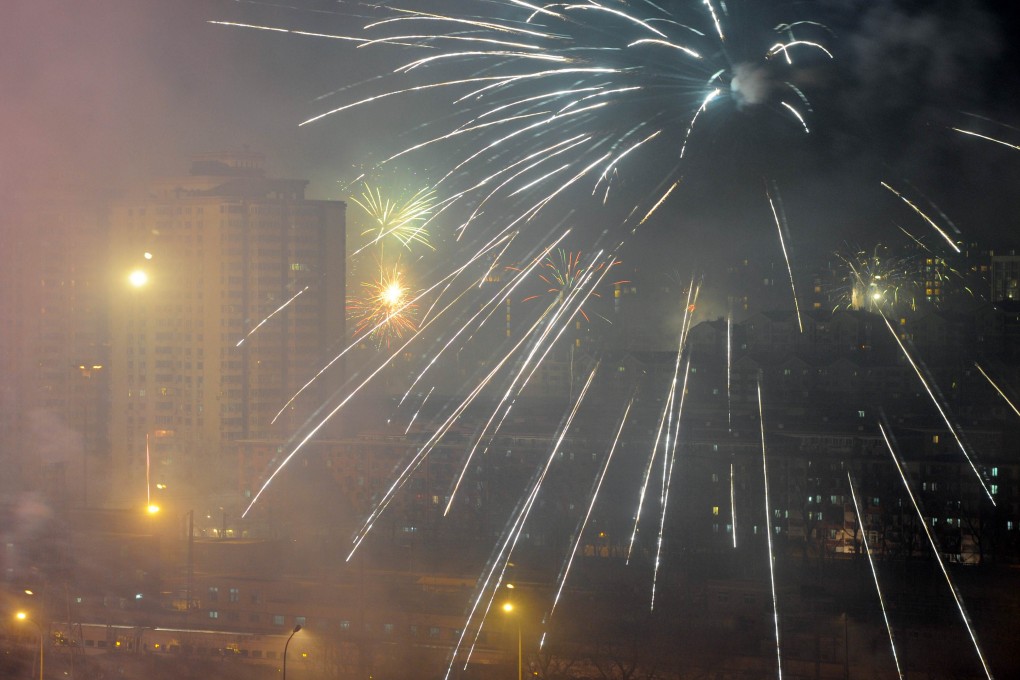 Fireworks explode over a residential area in Beijing. The city has set up hundreds of stalls to sell fireworks this year. Photo: AFP