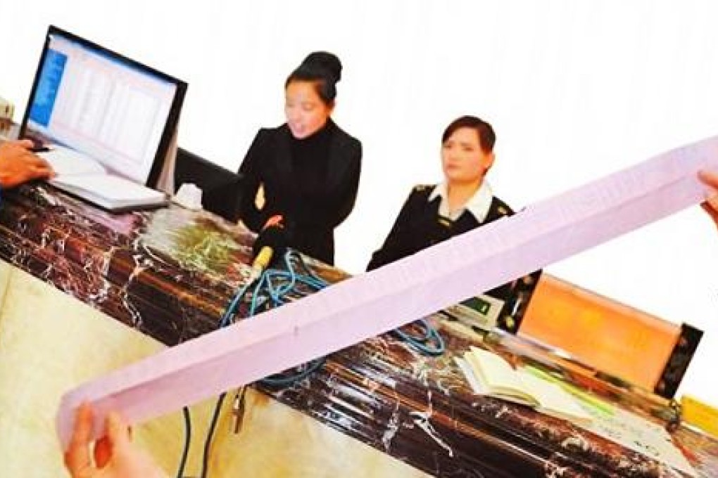 Staff at a Kunming hotel spa show the tab for a 14-year-old boy's four day spending binge to get even with his "negligent" dad. Photo: SCMP Pictures