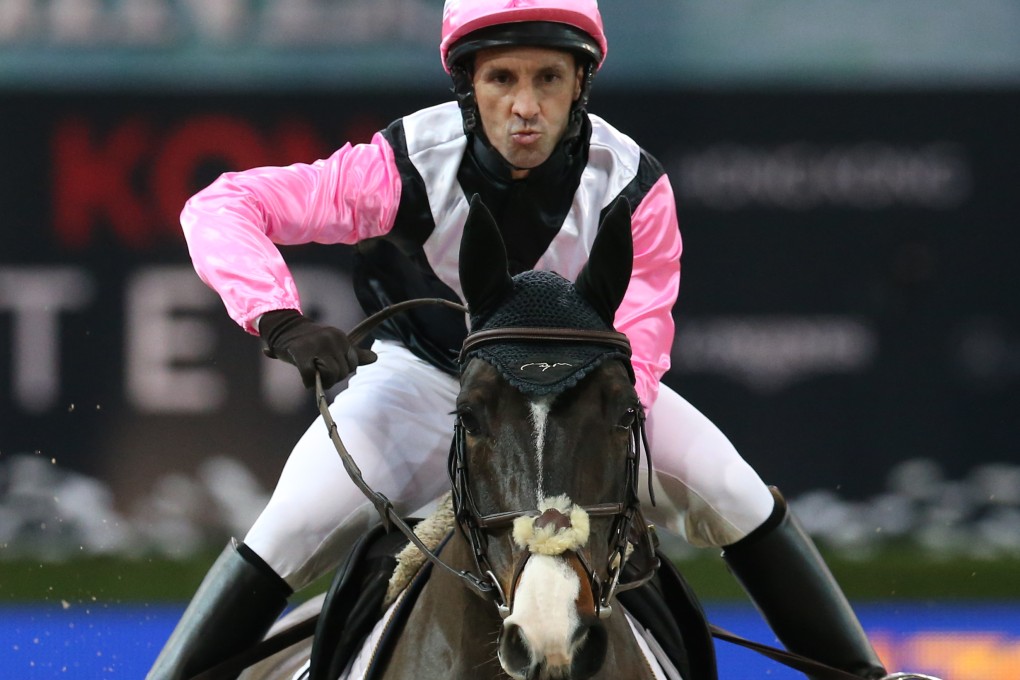 Irish jockey Neil Callan strikes an ungainly pose during the "Race of the Riders" at the Longines Hong Kong Masters at AsiaWorld-Expo. Photo: K.Y. Cheng