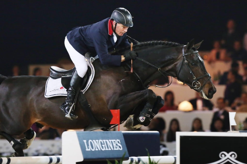 Britain's John Whitaker and Argento on their way to victory in the Longines Grand Prix at the AsiaWorld Expo. Photos: Nora Tam