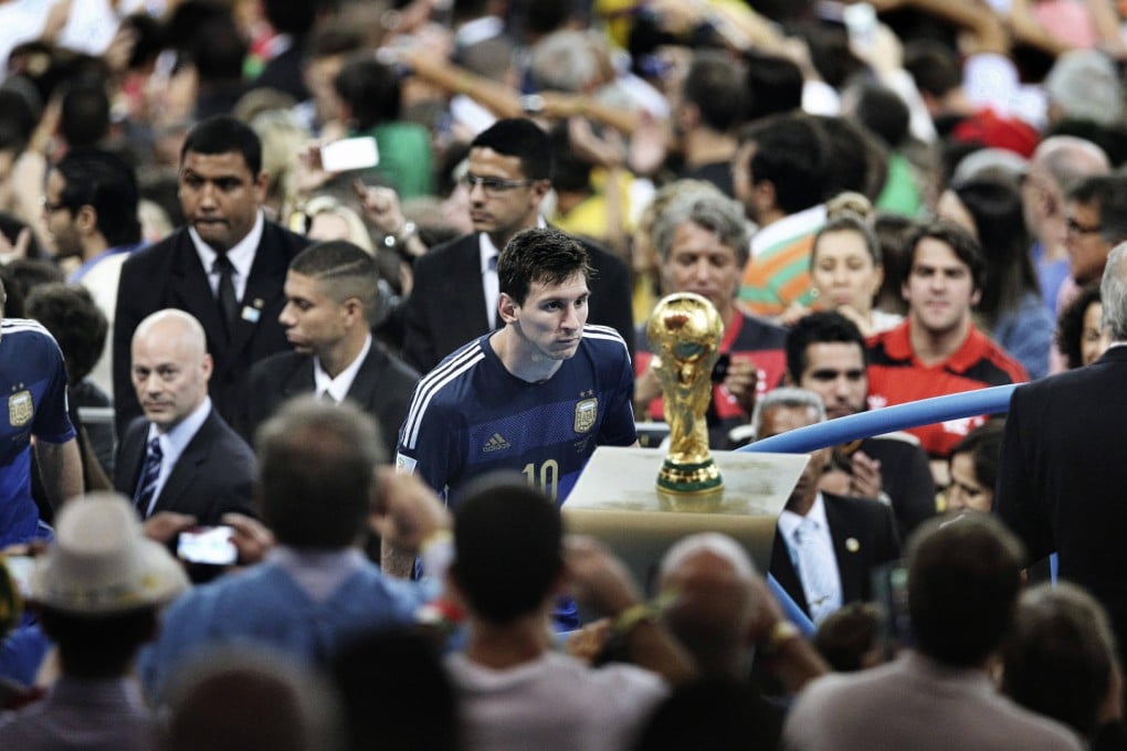 Bao Tailiang's photo of Lionel Messi staring at the World Cup trophy.