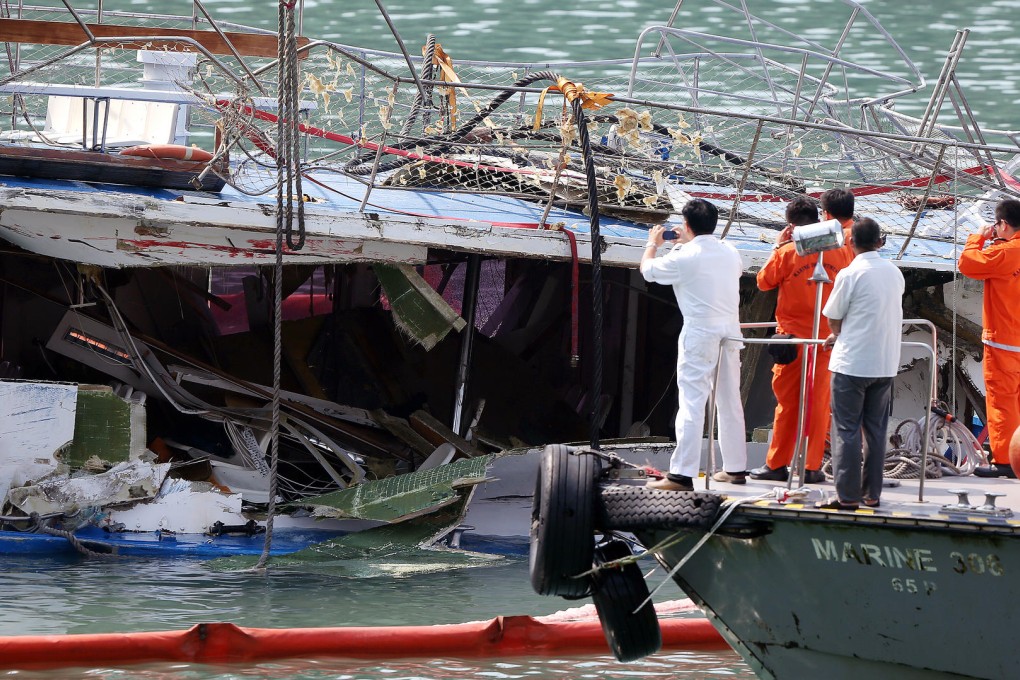 Police inspect the badly damaged Lamma IV ferry following the disastrous collision off Lamma Island in 2012. Photo: David Wong